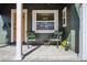 Inviting front porch with tiled floor, seating area, neutral decor, and outdoor accents at 2125 Acorn S Pl, St Petersburg, FL 33712