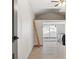 Bright room with vaulted ceilings, sliding glass door to yard, and a laundry area at 2125 Acorn S Pl, St Petersburg, FL 33712