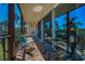 View of the balcony featuring brick flooring, seating, and open view to the outside at 3021 Countryside Blvd # 24A, Clearwater, FL 33761