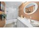 Well-lit bathroom features a shower/tub, neutral colored walls, and ample counter space at 3021 Countryside Blvd # 24A, Clearwater, FL 33761