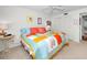 Inviting bedroom with bright quilt, shuttered windows, ceiling fan, and comfortable seating at 3021 Countryside Blvd # 24A, Clearwater, FL 33761