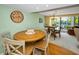 Cozy dining space with comfortable seating and an inviting ambiance adjacent to the living area at 3021 Countryside Blvd # 24A, Clearwater, FL 33761