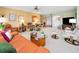 Open living room features comfortable seating with a view of the bar and entertaining area at 3021 Countryside Blvd # 24A, Clearwater, FL 33761