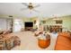 Cozy living room with comfortable seating and an open floor plan with a dining area at 3021 Countryside Blvd # 24A, Clearwater, FL 33761