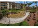 Scenic condo community boasting a serene water feature and lush, vibrant landscaping at 3021 Countryside Blvd # 24A, Clearwater, FL 33761