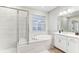 Modern bathroom with separate shower and tub and double sink vanity at 33886 Landsman Loop, Wesley Chapel, FL 33543