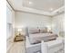 Calm bedroom with tray ceiling, large bed, and bright, natural light at 33886 Landsman Loop, Wesley Chapel, FL 33543