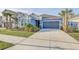 Charming home with a two-car garage, well-manicured lawn, and lovely landscaping at 33886 Landsman Loop, Wesley Chapel, FL 33543