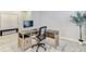 Neat home office with L-shaped desk, stylish decor and great natural lighting at 33886 Landsman Loop, Wesley Chapel, FL 33543