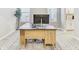 Clean home office featuring large desk, bright windows and modern design elements at 33886 Landsman Loop, Wesley Chapel, FL 33543