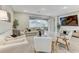 Cozy living room featuring a sliding glass door to the backyard and contemporary furnishings at 33886 Landsman Loop, Wesley Chapel, FL 33543