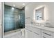 Modern bathroom showcasing a glass-enclosed shower, sleek fixtures, and vanity at 5131 W Neptune Way, Tampa, FL 33609