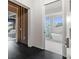 Hallway view to luxurious bathroom with stand-alone tub and frameless glass shower at 5131 W Neptune Way, Tampa, FL 33609