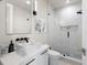 Modern bathroom featuring a walk-in shower, sleek vanity, and contemporary fixtures and finishes at 5131 W Neptune Way, Tampa, FL 33609