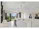 Contemporary kitchen featuring white cabinetry, marble countertops, and stainless steel appliances at 5131 W Neptune Way, Tampa, FL 33609