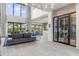 Inviting living room features comfortable seating, wine storage, and ample natural light at 5131 W Neptune Way, Tampa, FL 33609