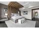Stunning main bedroom with ceiling detail, stylish furniture, and large windows at 5131 W Neptune Way, Tampa, FL 33609