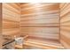 Relaxing home sauna with wooden interior and traditional sauna accessories at 5131 W Neptune Way, Tampa, FL 33609