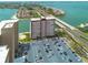 Striking aerial view highlighting condo with parking, serene waterfront views, and easy bridge access at 5220 Brittany S Dr # 210, St Petersburg, FL 33715