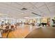 Spacious banquet hall with tables and chairs set up, chandelier lighting, and a stage area for events at 5220 Brittany S Dr # 210, St Petersburg, FL 33715
