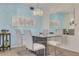 Contemporary condo dining room featuring stylish table, chairs, modern light fixture, and ample space for entertaining at 5220 Brittany S Dr # 210, St Petersburg, FL 33715