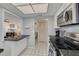 View of the eat-in kitchen with stainless appliances and granite countertops at 5220 Brittany S Dr # 210, St Petersburg, FL 33715
