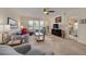 Bright and airy condo living room with comfortable seating, water view, and seamless access to other rooms at 5220 Brittany S Dr # 210, St Petersburg, FL 33715