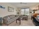 Inviting living room offers water views, comfortable seating, and natural light at 5220 Brittany S Dr # 210, St Petersburg, FL 33715