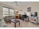 Comfortable living room and office space with beautiful water views, desk, and sofas at 5220 Brittany S Dr # 210, St Petersburg, FL 33715