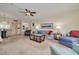 Spacious condo living room with comfortable seating, natural light, open layout, and access to dining area at 5220 Brittany S Dr # 210, St Petersburg, FL 33715