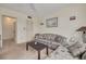 This living room features a comfortable sofa and a view of the hallway and adjacent rooms at 5220 Brittany S Dr # 210, St Petersburg, FL 33715