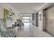 Inviting condo lobby featuring stylish seating, modern art, tile floors, and convenient elevator access at 5220 Brittany S Dr # 210, St Petersburg, FL 33715