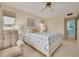 Cozy main bedroom with a ceiling fan and view to the on-suite bathroom at 5220 Brittany S Dr # 210, St Petersburg, FL 33715