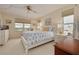 Comfortable main bedroom with a large window offering water views at 5220 Brittany S Dr # 210, St Petersburg, FL 33715