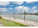 Scenic waterfront view with palm trees and a distant skyline at 5220 Brittany S Dr # 210, St Petersburg, FL 33715