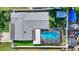 Directly overhead shot of a home highlighting its gray roof and private, screened-in pool at 5248 Coral N Way, St Petersburg, FL 33714
