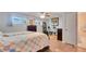 Well-lit bedroom with neutral walls, wood floors, and ample space for a comfortable lifestyle at 5248 Coral N Way, St Petersburg, FL 33714