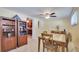 Dining area with adjacent kitchen, featuring built-in cabinets and storage at 5248 Coral N Way, St Petersburg, FL 33714