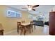 Cozy dining area with tile flooring and open access to the living room and kitchen at 5248 Coral N Way, St Petersburg, FL 33714