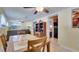 View of the dining area opening into the living room and adjacent kitchen at 5248 Coral N Way, St Petersburg, FL 33714