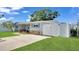 Charming single story home with stone accents, beautiful yard and white vinyl privacy fence at 5248 Coral N Way, St Petersburg, FL 33714