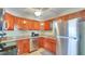 Efficient kitchen featuring stainless steel appliances, granite countertops, and ample cabinet space at 5248 Coral N Way, St Petersburg, FL 33714