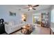 Comfortable living room with neutral tones, a decorative brick wall, and ample natural light at 5248 Coral N Way, St Petersburg, FL 33714