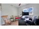 Bright office space featuring natural light, modern desk, and seating area with rocking chair and small bench at 5248 Coral N Way, St Petersburg, FL 33714