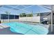 Sparkling pool inside a screened enclosure providing a private and refreshing outdoor oasis at 5248 Coral N Way, St Petersburg, FL 33714