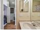 A bright bathroom with views into the laundry room that features a washer and dryer at 542 Black Lion Ne Dr, St Petersburg, FL 33716