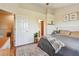 Comfortable bedroom featuring natural light, stylish decor, and comfortable queen bed at 542 Black Lion Ne Dr, St Petersburg, FL 33716