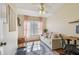 Inviting bedroom features a comfortable sofa, soft pink curtains, and a cozy rug, creating a serene and relaxing atmosphere at 542 Black Lion Ne Dr, St Petersburg, FL 33716