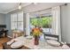Well-lit dining area next to sliding glass doors that lead to an outdoor space at 542 Black Lion Ne Dr, St Petersburg, FL 33716