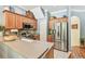 Bright kitchen featuring stainless steel appliances, wooden cabinetry, and light countertops at 542 Black Lion Ne Dr, St Petersburg, FL 33716